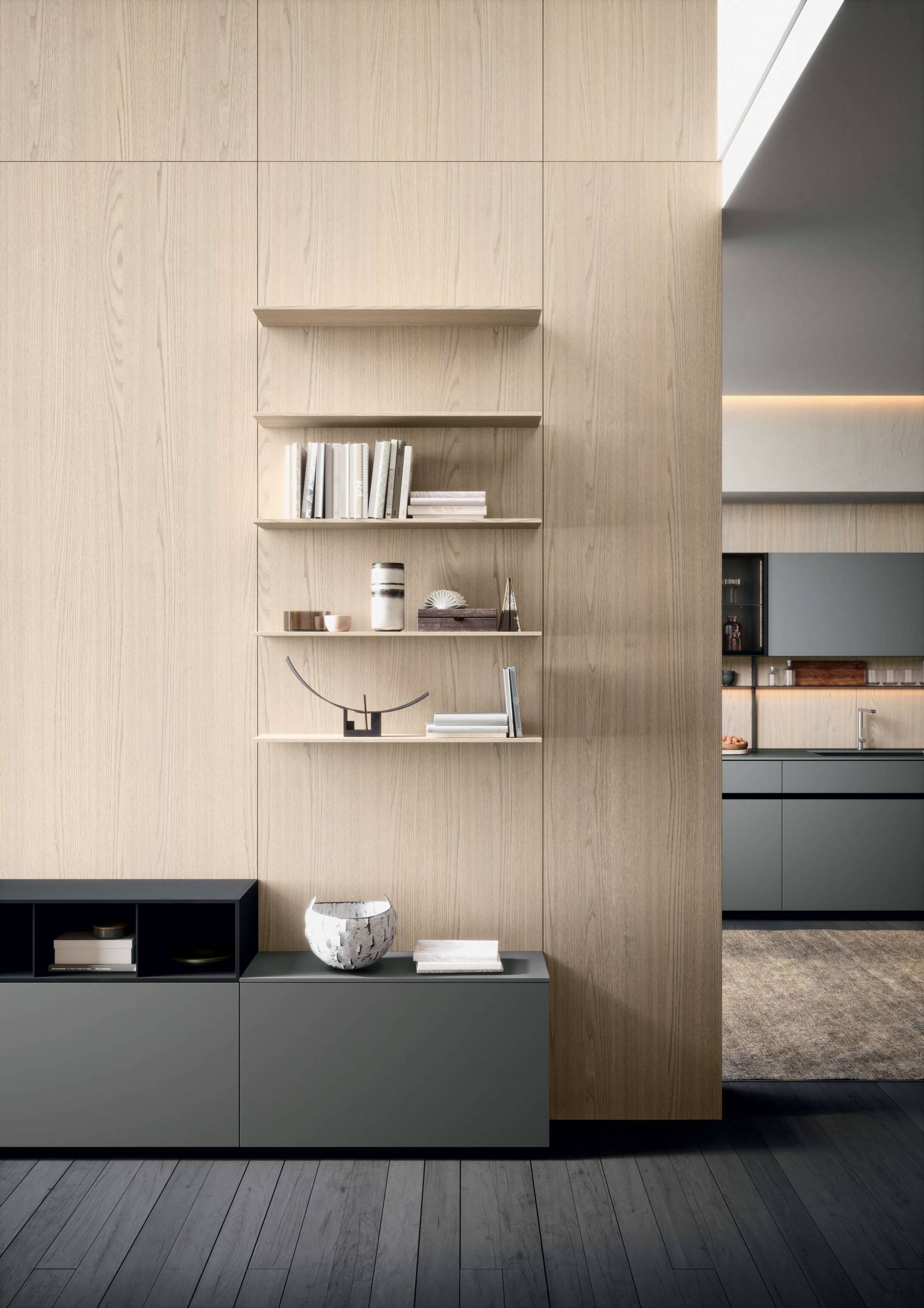 L'éffet de légèreté de la paroi entièrement réalisée en boiserie Light, en finition essence Orme Blanchi, est donné par les étagères d'épaissuer 1.2cm.