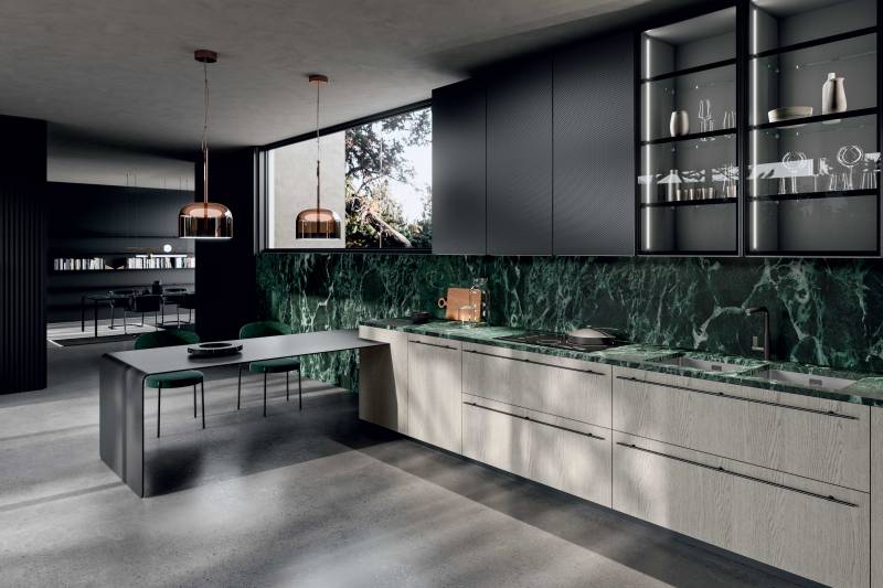 L'ef fet tex turée de la por te diamant crée  des jeux de lumière fascinants sur la sur face.  En détail aussi le profil led Oslo sous le  meuble haut